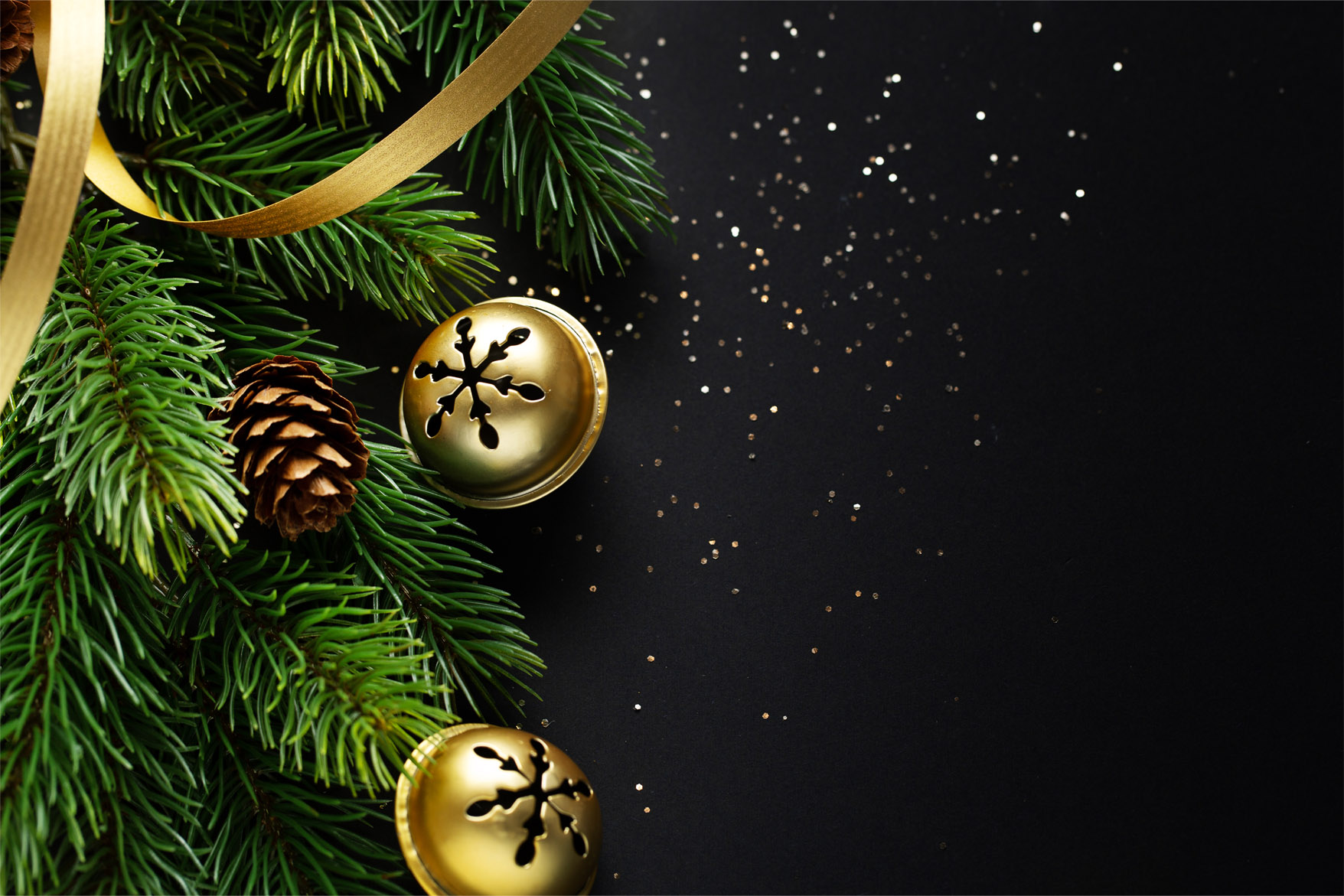 Christmas deco with fir and baubles on dark background. Closeup. Christmas concept